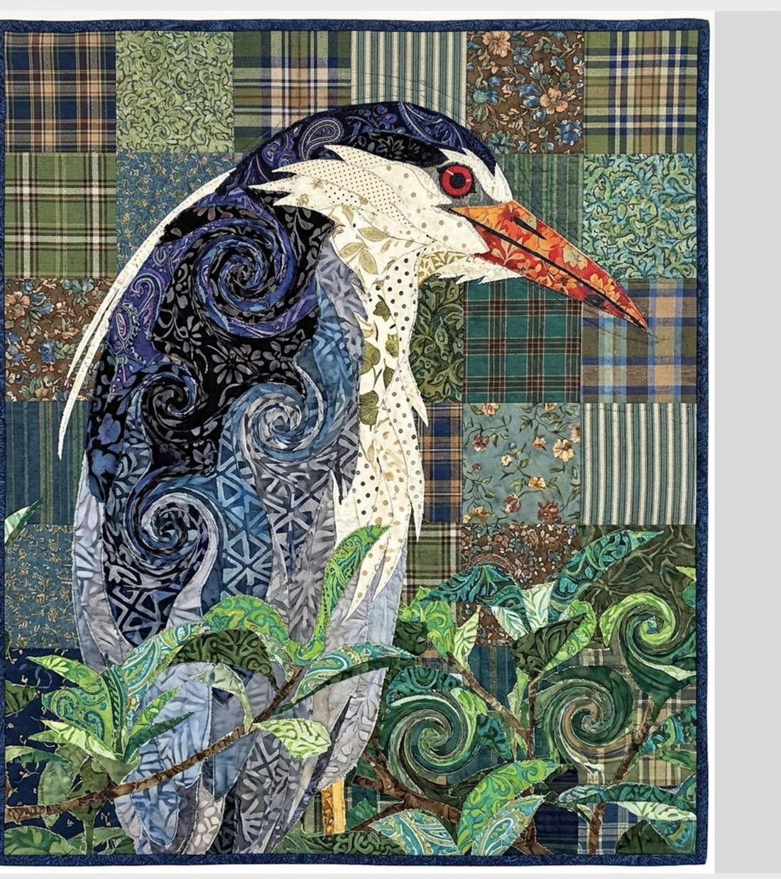 A heron rebuilt as a fabric-collage quilt in TraceWorks